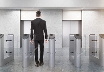 Security turnstiles in an office lobby